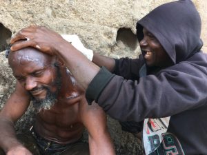 One of the mentally challenged persons having a hair cut during the monthly clean up in Kaduna