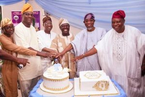 Aregbesola, Lai Mohammed join in cutting of Akande 81st birthday cake
