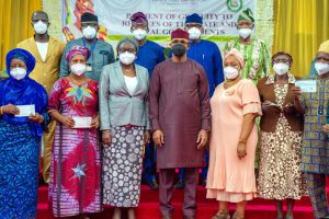 Governor Abiodun and some of the pensioners with their cheques