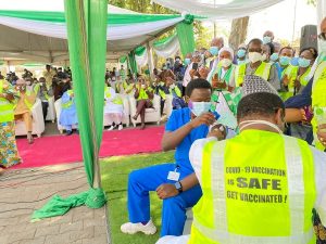 Dr Cyprian Ngon, a medical doctor with National hospital Abuja, taking the first shot of COVID-19 administered in Nigeria.