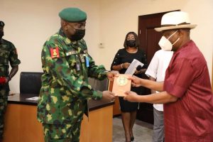 Governor of Rivers State, Nyesom Ezenwo Wike (right) receives a plaque from Chief of Army Staff, Lt. General Ibrahim Attahiru during the latter's courtesy call at the Government House, Port Harcourt on Tuesday.