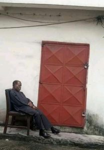 The landlord sitting at the entrance to the PHEDC office