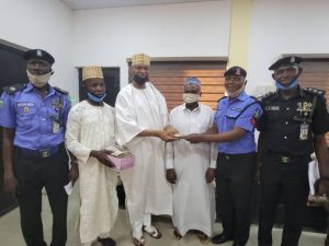Kano Commissioner of Police, Mr Sama’ila Dikko, handing over the money to the relatives of the deceased