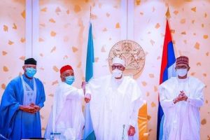 President Buhari (second from left) welcoming Nwaoboshi