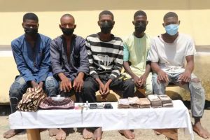 The suspected kidnappers and the recovered N1.3 million by operatives of FCT Police Command