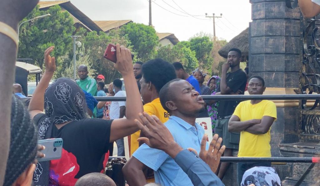 Some members of SCOAN weeping outside the church on Sunday( Photo: Taiwo Okanlawon)
