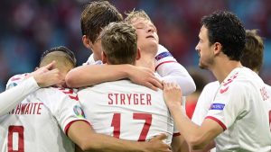 Denmark players celebrate Kasper Dolberg who inspired a convincing 4-0 win over Wales on Saturday and took them into the quarter-finals of Euro 2020.