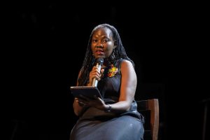 Molara Wood reading from Mr Benson's book, Dis Fela Sef