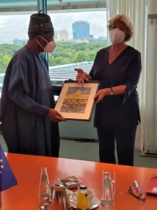 Picture 1: The German Minister of State for Culture, Prof. Moniker Grutters (right), presenting a gift to the Minister of Information and Culture, Alhaji Lai Mohammed, during a meeting on the repatriation of looted Benin Bronzes to Nigeria, in Berlin, Germany, on Wednesday.