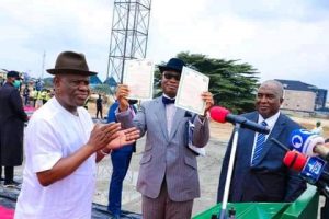 Governor Nyesom Wike presenting Certificate of Occupancy (C of O) of the land on which the law school campus and the Staff Quarters are being built to Nnaemaka Ngige, SAN, the representative of Abubakar Malami, the AGF and Minister Justice