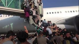 Chaotic scene at Kabul airport on Monday as Afghans rush to leave Afghanistan after Taliban's takeover