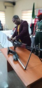The fabricated high calibre G3 rifle with 78 rounds of life ammunition (RLA) of 7.62mm calibre and five empty shells recovered by Christian Chidiebere being dismantled at NDLEA office