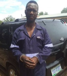 Ifeanyi Christopher with the stolen car