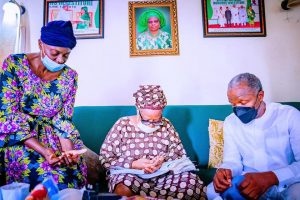 Vice President Yemi Osinbajo praying with Ganiat, the mother of late Mohammed Fawehinmi during his visit to the home of the family of the deceased in Lagos on Saturday