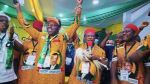 Governor Willy Obiano lifts Soludo;s hands up when he was declared winner of APGA primary
