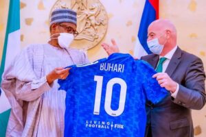 FIFA President Gianni Infantino presents No 10 jersey to Buhari during the visit of the FIFA delegation to Presidential Villa