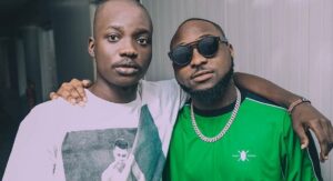 Right to left: Davido and his official photographer, Fortunate Umunname Peter, aka Fortune who died on Tuesday evening