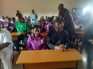 Photo: Mr. Dennis Idahosa with the students in one of the newly constructed classrooms