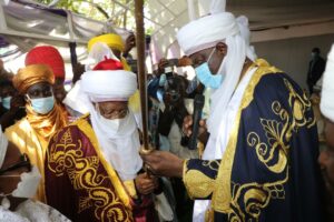 The Wife of Minister of Information and Culture, Mrs. Kudirat Lai Mohammed; Minister of Information and Culture, Alhaji Lai Mohammed and the Emir of Argungu, Alhaji Sama’ila Muhammad Mera, while presenting an Instrument of Office to the Minister after his turbaning as the 'Kakakin Kabi' in Argungu, Kebbi State, on Sunday.