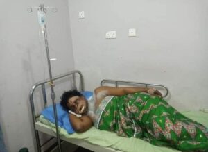 The victim on her hospital bed