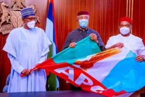 Okeke (middle) being formally presented to President Muhammadu Buhari by Gov. Hope Uzodimma of Imo at the State House, Abuja on Wednesday.
