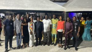 Sele-epri Matthew,(in white T-shirt) the founder and CEO of McMatthy Nigeria limited Management,staff and guests at end of year party