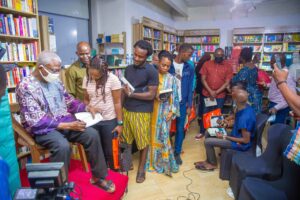 Professor Osundare autographing his books at the book reading tagged An Evening with Professor Osundare which held at Roving Heights in Victoria Island, Lagos on Sunday 20 February 2022 ( Photo: Ayo Efunla)