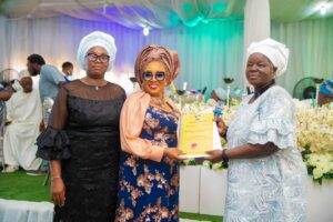 Chairman, TESCOM, Mrs Olabisi Ariyo(left) presenting certificate of service to Mrs Toyin Onanuga
