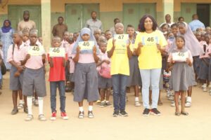 Mrs Duma Edward-Dibiana of Ugo Edward-Dibiana Down Syndrome Foundation and school children during one of the sensitization at a school in Abuja