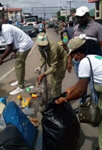 Top officials NYSC and Obio-Akpor Local Government Area during the flag off of NYSC national environmental sanitation in Rumuodomaya.