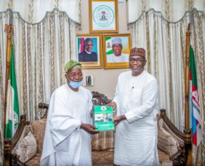 Kwara State Governor Abdulrazak Abdualrahman receiving the report of the panel of inquiry on the Hijab question at the Oyun Baptist School, Ijagbo,