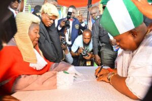 Chief Judge of Osun, Justice Adepele Ojo, administering the oath of office on Ademola Adeleke at the Osogbo City Stadium as the new state governor