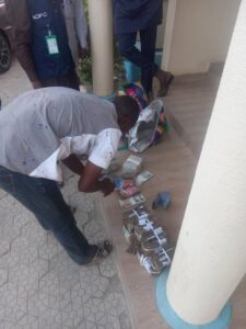 Hassan Ahmad with the sum of N2 million in he was arrested with in Alkaleri area of Bauchi State on Friday.