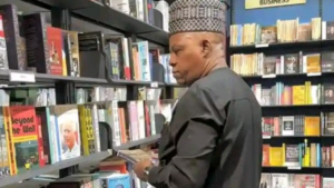 Kashim Shettima examining books