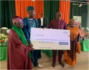 From Right:Managing Director/CEO of Unity Bank Plc, Mrs Oluwatomi Somefun; Regional Manager, Unity Bank, Mr Segun Olarenwaju presenting cheque to the Onifiditi of Fiditi, Oba Sakiru Oyewole Adekola-Oyelere, Ajani-Eedu II and the Chairman of the Committee, Professor John Oluokun during the during the official launch and Groundbreaking of National Open University of Nigeria, Fiditi Study Centre on Saturday at Fiditi Grammar School, Oyo state