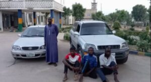 Saminu Mohammed ,standing, and three other suspects