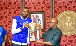 Victor Anthony Koko, Captain of the club presenting the trophy won by the Rivers Hoopers Basketball Club to Governor Siminalayi Fubara in Government House, Port Harcourt on Friday