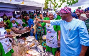 Lagos State Governor, Mr Babajide Sanwo-Olu viewing closely some food items during the grand finale of Y2023 World Food Day celebrations, themed: “Water is Life, Water is Food, Leave No One Behind”, at the Police College Parade Ground, Ikeja, on Monday, 16 October 2023.