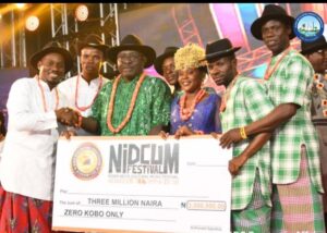 The NDDC Director Corporate Affairs, Mr. Pius Ughakpoteni,(middle) congratulating the winners of Niger Delta Cultural Music Festival, the Creative Minds of Bayelsa State, after the event in Port Harcourt.