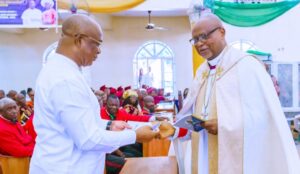 Governor Hope Uzodimma of Imo State receives the Bishop's Charge from Rt. Rev. Godson U. Ukanwa, Bishop of Isi Mbano Diocese, Ehime Mbano, Imo State during the closing programme of the Third Session of the 10th Synod of the Diocese held at St. James Church Umueze I in Ehime Mbano Local Government Area of Imo State... Sunday