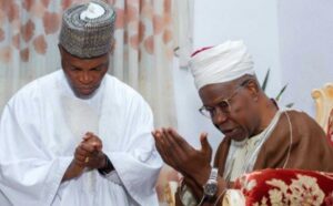 The Otaru of Auchi, Ikelebe Ikkc(right), praying for the Labour Party guber aspirant, Kenneth Imansuangbon