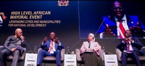 Governor of Lagos State, Mr. Babajide Sanwo-Olu (second left) addressing Government Heads, Business leaders and investors, Senior Advisor to the President (communications), African Development Bank Group, Dr. Victor Oladokun (left) and other panelists during a session at the Africa Investment Forum 2023: High level Mayoral event “Leveraging Cities and Municipalities on National Development” in Marrakesh, Morocco, on Thursday, 09 November 2023.