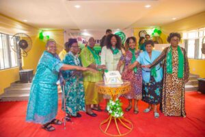 The President, New Era Girls Secondary School Alumnae Association, Mrs Adenike Bankole with BOT Members cutting the 75th anniversary cake
