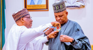 The National Chairman, Nigerian Legion, Maj. Gen.Abdulmalik Jibrin (retd) (L) decorates Vice-President Kashim Shettima with the 2024 Armed Forces Remembrance Day emblem at the Presidential Villa on Tuesday, November 21, 2023. (Photo: State House)