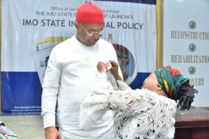 Governor Hope Uzodimma being decorated with the 2024 Armed Forces remembrance emblem by Mrs. Joy Moses, Chairperson, Military Windows in Imo State at the launch of the emblem at Government House Owerri... Thursday --