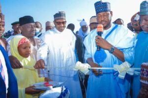 Former President Buhari and Governor Radda during the event