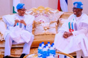 Former President Buhari. left, and Governor Sanwo-Olu