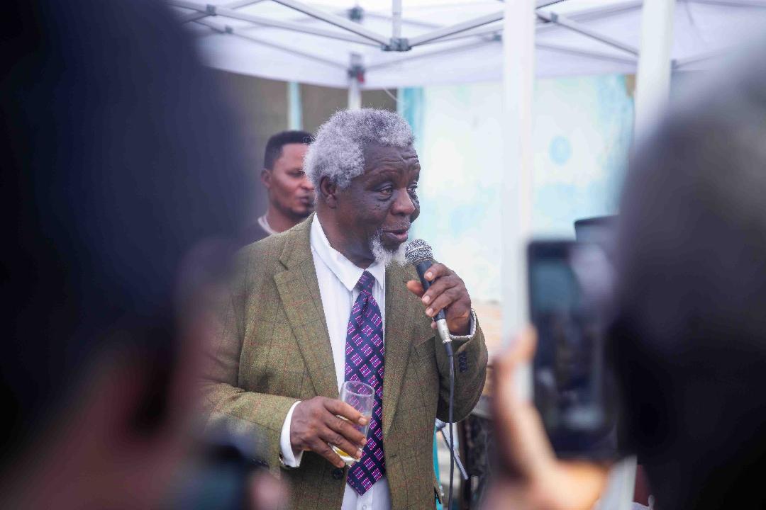 Reverend Kayode Soyinka singing old songs to the amusement of guests