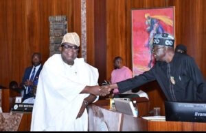 President Bola Tinubu, right and Professor Tunji Olaopa