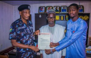 CP Gumel receiving one of the letters of commendations from good-spirited Nigerians, appreciating his efforts in crime-busting